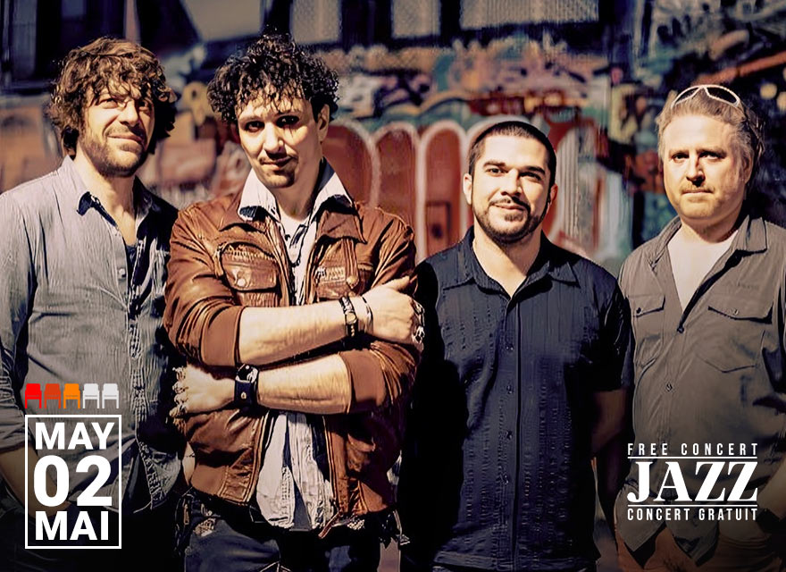 French jazz ensemble Beltuner poses in front of a vibrant, graffiti-covered wall. The four musicians stand close together, casually dressed, with relaxed expressions. A date graphic in the lower left corner reads "May 02 / Mai 02" alongside a row of colored seat icons indicating availability.