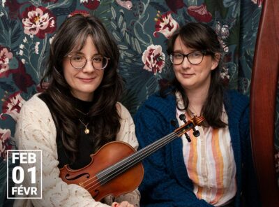 Portrait of fiddler Adrianna Ciccone and harpist Ellen Gibling seated side by side, Ciccone holding a fiddle and Gibling beside a harp, set against a dark floral backdrop. A date badge reads “Feb 01 / Févr,” with the Sensory-Accessible Concerts logo visible in the corner.
