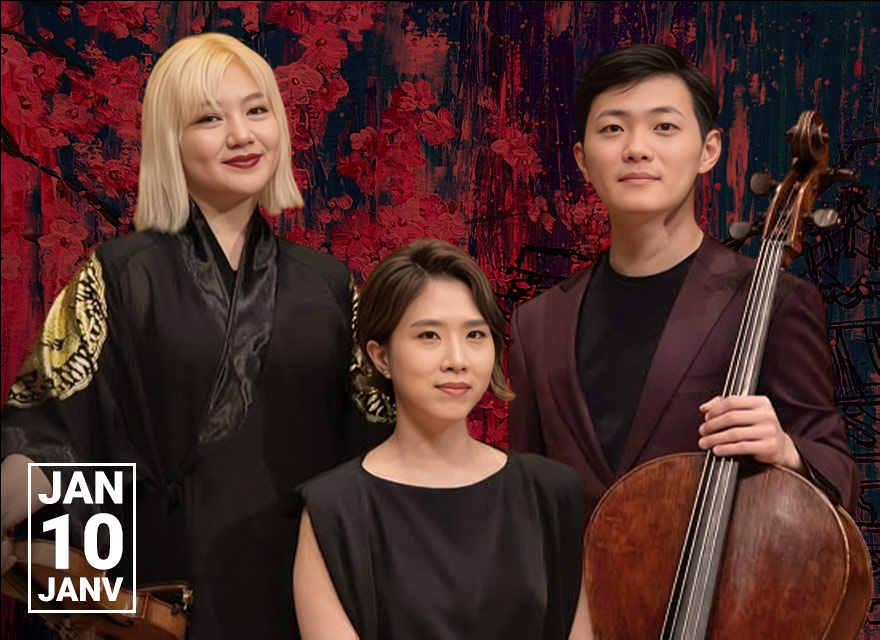 Three classical musicians pose indoors in a concert hall against an abstract red and black backdrop. On the left, a woman with shoulder-length blonde hair wears a black robe with gold designs on the sleeves and holds a violin. In the center, a seated woman with short dark hair wears a sleeveless black dress and looks calmly at the camera. On the right, a man with short black hair wears a dark plum suit and holds a cello upright beside him. In the bottom left corner, white text reads "JAN 10 JANV."