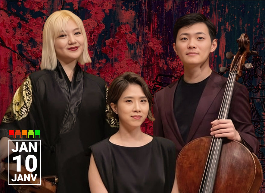 Three classical musicians pose indoors in a concert hall against an abstract red and black backdrop. On the left, a woman with shoulder-length blonde hair wears a black robe with gold designs on the sleeves and holds a violin. In the center, a seated woman with short dark hair wears a sleeveless black dress and looks calmly at the camera. On the right, a man with short black hair wears a dark plum suit and holds a cello upright beside him. In the bottom left corner, white text reads "JAN 10 JANV."