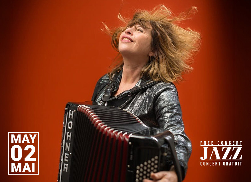 Alt text: Promotional image of musician Viviane Arnoux playing a Hohner accordion against a bright orange background, her hair lifted in motion as she looks upward with a joyful expression. Text on the image reads “May 02 / Mai” on the left and “Free Concert / Jazz / Concert Gratuit” on the right.
