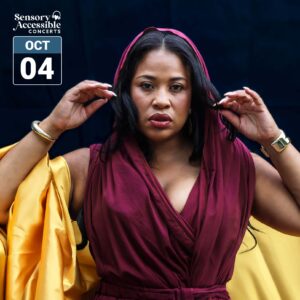 Dee Hernandez, wearing a deep burgundy dress with gold fabric draped around her arms, poses against a dark blue background. A Sensory Accessible Concerts logo and October 4 date graphic appear in the upper left.