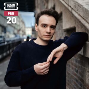 Concert graphic featuring pianist Jonathan Fournel in a navy sweater, leaning against a stone wall on a city street and looking toward the camera. His hands rest together in front of him. A white Main Stage Concerts logo and a red-and-white February 20 date badge appear in the upper left.