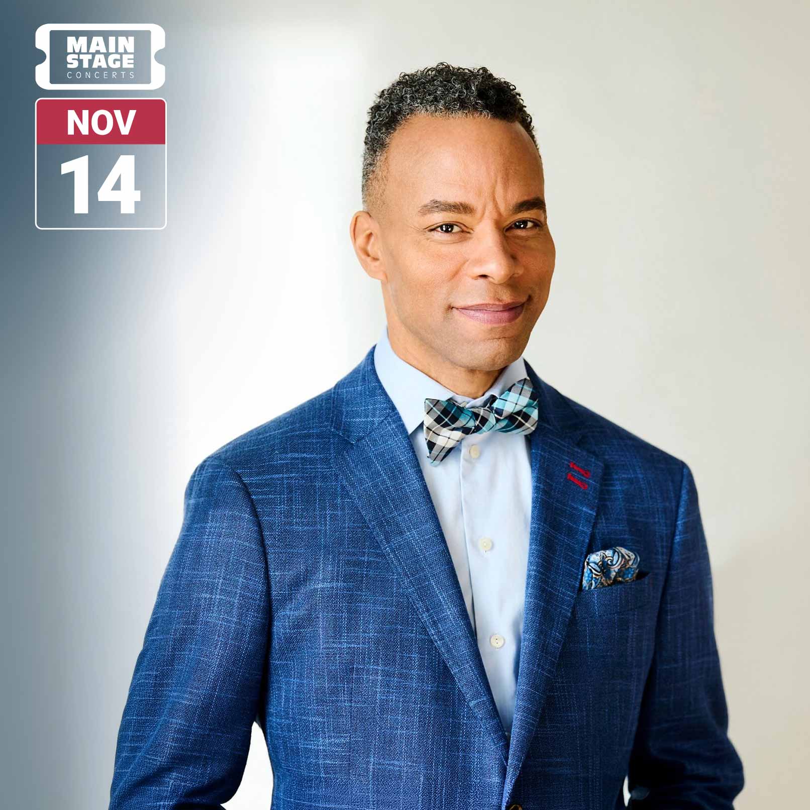 Portrait of a man wearing a blue plaid suit jacket, light blue shirt, and patterned bow tie against a light neutral background. A Main Stage Concerts graphic in the upper left displays the date November 14.