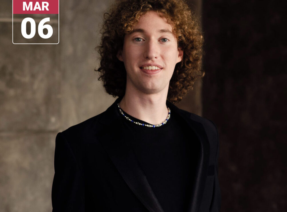 Pianist Michael Davidman stands against a taupe background in a studio portrait, looking at the camera with a slight smile. The image includes the Main Stage Concerts logo and a date badge reading March 6.