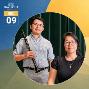 Promotional graphic for Cecilia Concerts’ Daylight Concerts series on December 9. A large circular photograph features clarinetist Tim Yung standing on the left, holding a black clarinet, and pianist Cindy Thong seated on the right. Yung wears glasses, a patterned white shirt, and grey trousers. Thong wears glasses, a black top, and a gold necklace. Dark green curtains form the photograph’s background. The graphic features overlapping geometric shapes in blue, golden yellow, and muted green. The white Daylight Concerts logo appears in the upper left, above a calendar-style graphic displaying “DEC 09” in large white lettering.