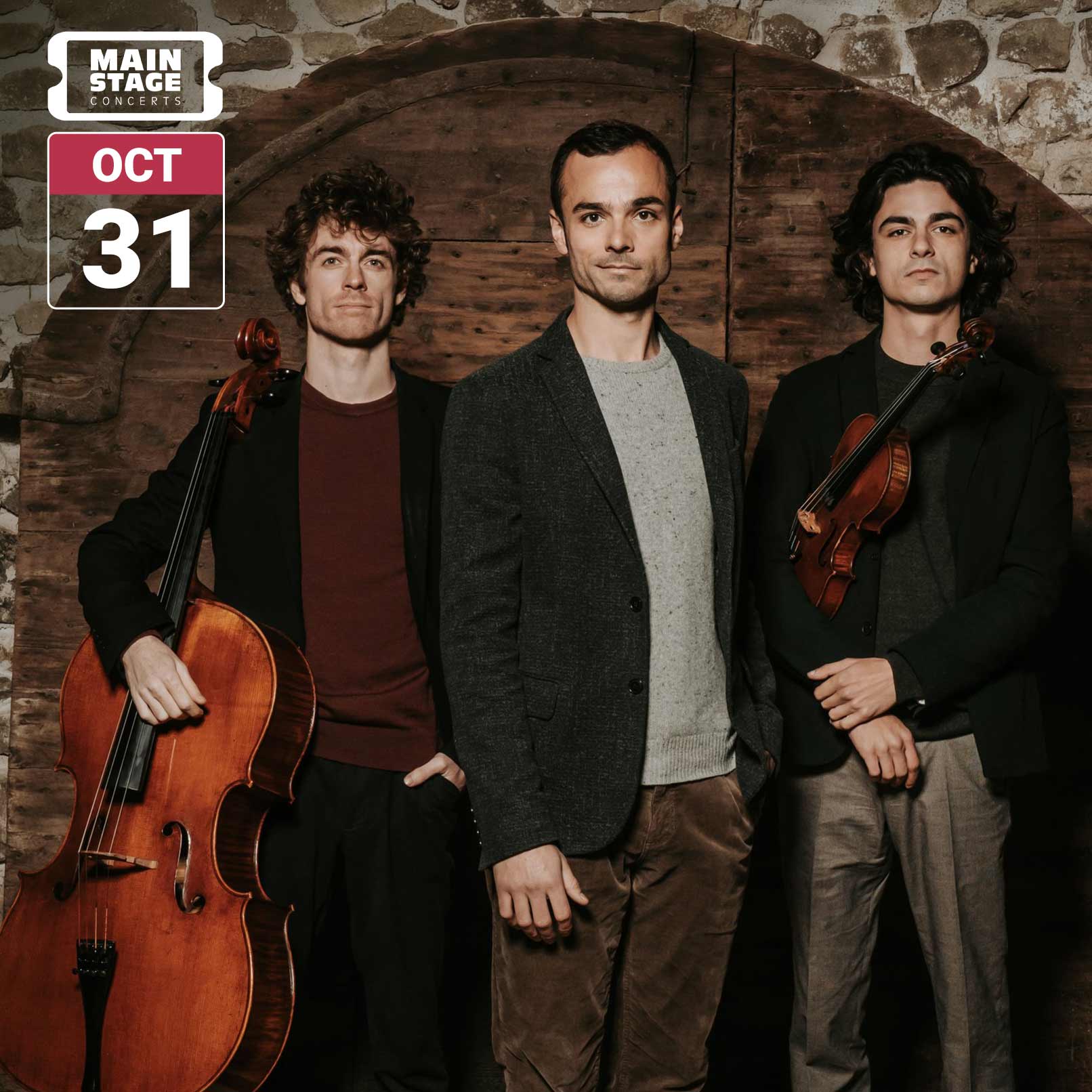 Trio Hélios stand together in front of a rustic stone and wood backdrop, with two musicians holding a cello and violin. The image includes the Main Stage Concerts logo and a date badge reading October 31.